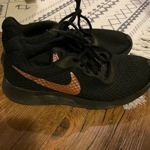 Black and rose gold nikes